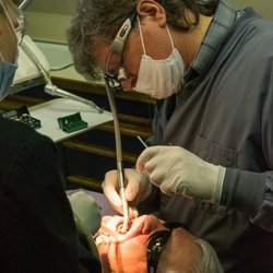 5 Mile Smiles - Dr. Keefe performing root canal therapy at his clinic 5 Mile Smiles Spokane