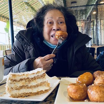 Papagalino Bakery - Napoleon and Loukoumades (sweet fritters served warm with honey syrup sprinkled with cinnamon and nuts) - Bakeries Near Me - Niles, Illinois Papagalino Bakery - Napoleon and Loukoumades (sweet fritters served warm with honey syrup sprinkled with cinnamon and nuts) - Bakeries Near Me - Niles, Illinois