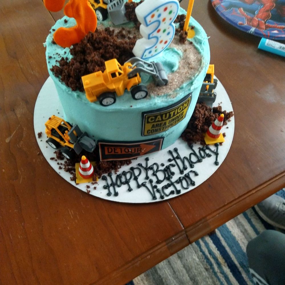 a birthday cake with a construction theme