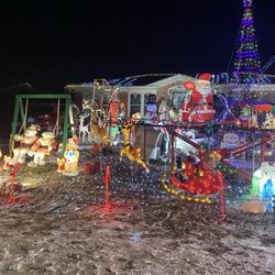 The Awesome Christmas Roller Coaster - December 2025 -- Roller Coaster house has a ton of animated figurines.