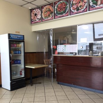 China King - Plain restaurant. Two tables for dine-in, or perhaps for waiting for take-out orders. - Asian Fusion Near Me - Florissant, Missouri China King - Plain restaurant. Two tables for dine-in, or perhaps for waiting for take-out orders. - Asian Fusion Near Me - Florissant, Missouri
