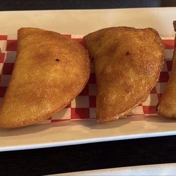 Fogonero Restaurant - Cedar Park - Four mini-empanadas: chicken, shredded meat, ground beef, and cheese. - Venezuelan Near Me - Cedar Park, Texas Fogonero Restaurant - Cedar Park - Four mini-empanadas: chicken, shredded meat, ground beef, and cheese. - Venezuelan Near Me - Cedar Park, Texas
