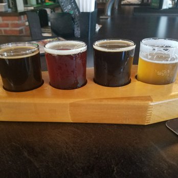 The Phoenix Brewing Co - Flight from left to right: Metamorphus stout (14.5% abv!), the undertaker imperial red ale, chai porter and redemption ipa - Breweries Near Me - Mansfield, Ohio