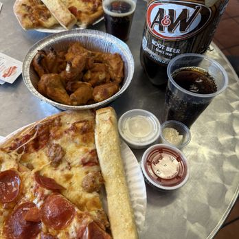 St. Mary's Pizza - Family Meal Deal 2 XL one-topping pizzas, 12 hot wings, a liter soda, and a huge tray of garlic bread with Parmesan cheese & sauce. - Pizza Near Me - Hemet, California St. Mary's Pizza - Family Meal Deal 2 XL one-topping pizzas, 12 hot wings, a liter soda, and a huge tray of garlic bread with Parmesan cheese & sauce. - Pizza Near Me - Hemet, California