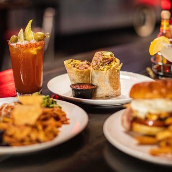 The District Lounge - three plates of food and drinks - New American Near Me - Orange, California