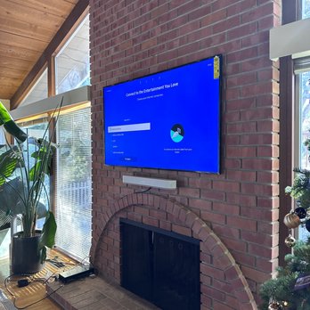 Universal Mounting Services - Samsung Frame TV 65" on a brick wall with Sonos sound bar. - TV Mounting Near Me Universal Mounting Services - Samsung Frame TV 65" on a brick wall with Sonos sound bar. - TV Mounting Near Me