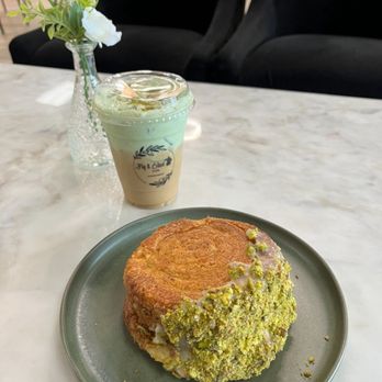 Fig and Olive Cafe - Pistachio latte & pistachio pastry. (Soooo much pistachio filling) - Desserts Near Me - Greensboro, North Carolina Fig and Olive Cafe - Pistachio latte & pistachio pastry. (Soooo much pistachio filling) - Desserts Near Me - Greensboro, North Carolina