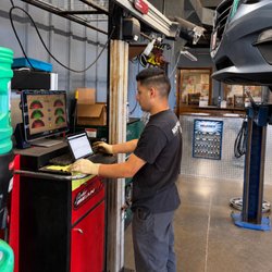 Northeast Motor Repairs - Lucas checks the alignment readings to help keep this vehicle tracking straight and its tires wearing evenly.