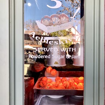 Solvang Restaurant - Aebleskiver being doled out for the throngs of hungry visitors seeking the traditional Danish treat. - Scandinavian Near Me - Solvang, California Solvang Restaurant - Aebleskiver being doled out for the throngs of hungry visitors seeking the traditional Danish treat. - Scandinavian Near Me - Solvang, California