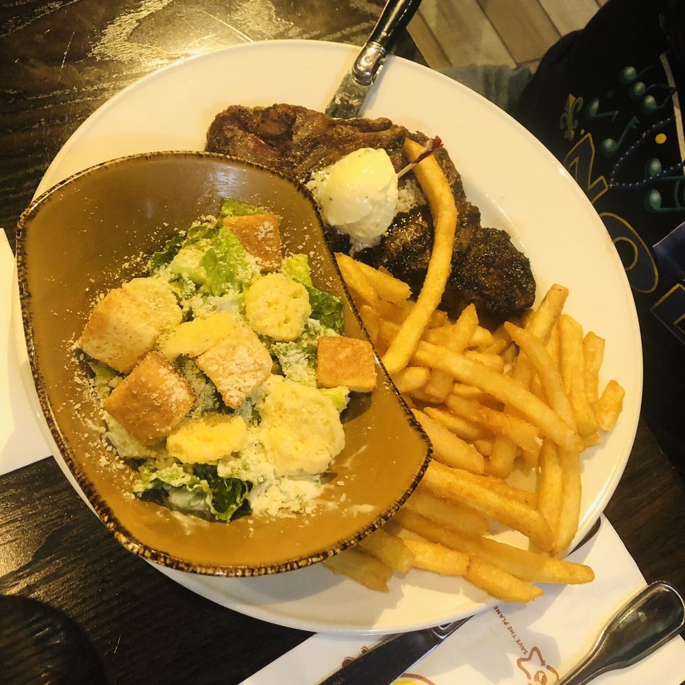 Hard Rock Cafe - NY strip with Caesar salad and fries - American Near Me - New Orleans, Louisiana Hard Rock Cafe - NY strip with Caesar salad and fries - American Near Me - New Orleans, Louisiana