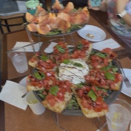 Bruschetta with fresh burrata and melon with prosciutto di Parma