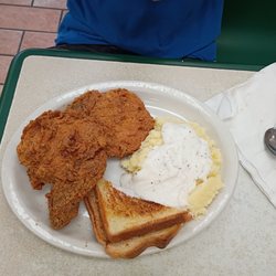 Fried pork chops, toast and potatoes with gravy