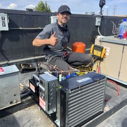 TopServ Appliance and HVAC - Installing a new condensing unit on the roof for a walk-in freezer to ensure reliable cooling and performance.