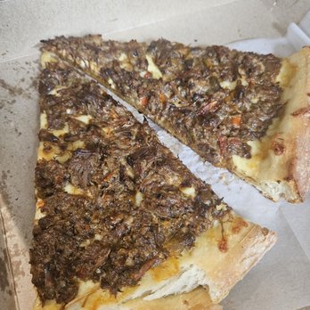 Cuts & Slices - Brown stewed oxtail pizza slice - Pizza Near Me - New York, New York