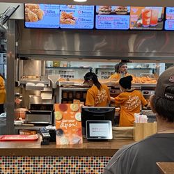 Popeyes Louisiana Kitchen - The guy in the back facing camera has been drinking, selling and doing drugs.