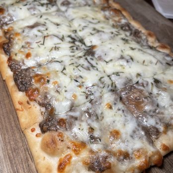 Perfusion Bar - a pizza with cheese and meat - Cocktail Bars Near Me - Newtown, Connecticut
