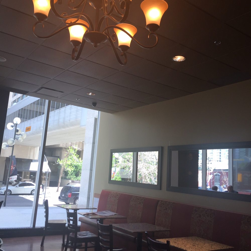 Caffè Artigiano - a chandelier in a restaurant - Coffee & Tea Near Me - Calgary, Alberta Caffè Artigiano - a chandelier in a restaurant - Coffee & Tea Near Me - Calgary, Alberta