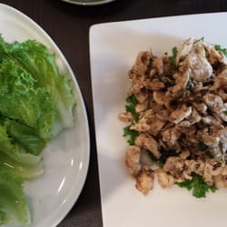 Chicken Larb with a side of lettuce leaves.