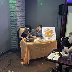 Hosts Casey and Nick scoring a round