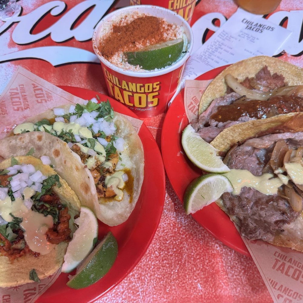 Chilangos Tacos - Dallas - Left to right: pastor taco, chicken quesadilla, elote, 2 ribeye tacos - Tacos Near Me - Dallas, Texas