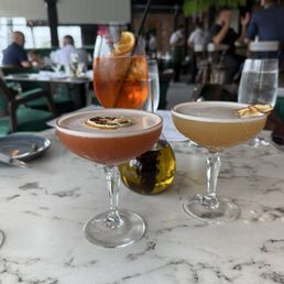 Aperol spritz, pear martini, dragon martini Aperol spritz, pear martini, dragon martini
