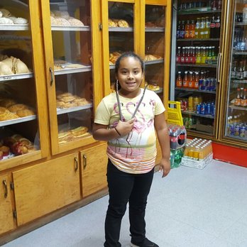 La Victoria Bakery - a young girl standing in front of a display of baked goods - Bakeries Near Me - Lawrenceville, Georgia La Victoria Bakery - a young girl standing in front of a display of baked goods - Bakeries Near Me - Lawrenceville, Georgia
