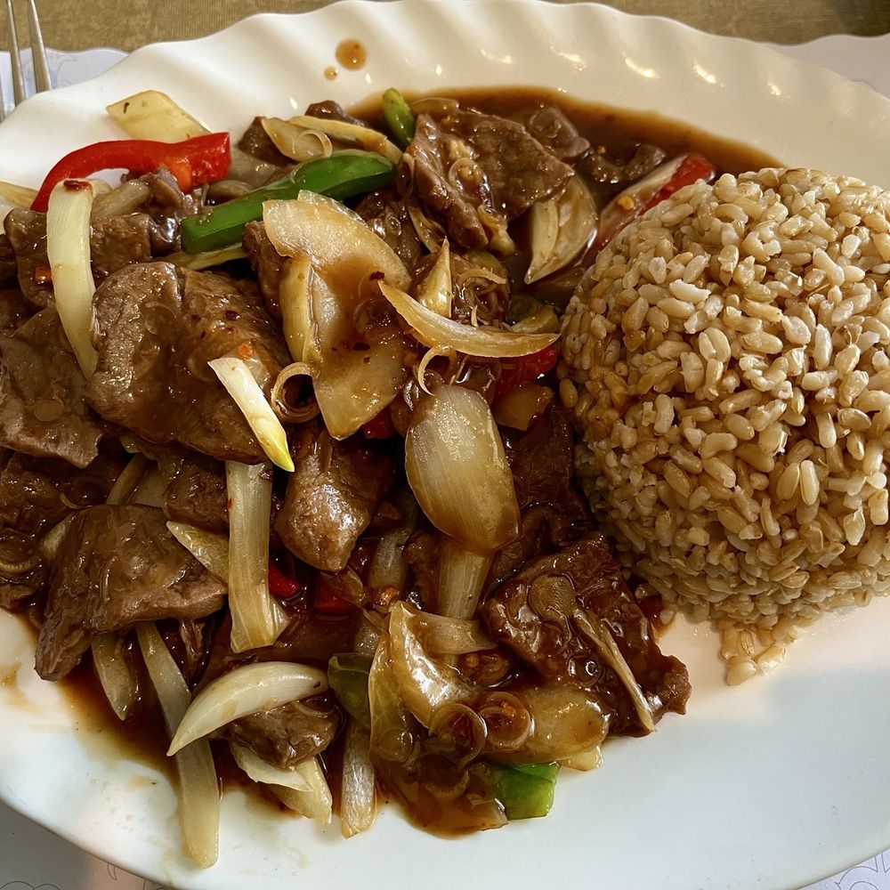 Vegan beef and vegetables in spicy garlic sauce with brown rice. Vegan beef and vegetables in spicy garlic sauce with brown rice.