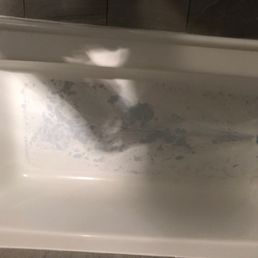 Bathtub covered in paint. Bathtub covered in paint.