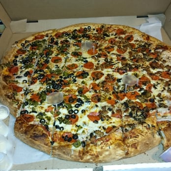 Amadeo's Pizza & Subs - The 26" pie with garlic, pepperoni, mushrooms, Italian sausage, green chile, & olives. Around $43.00 - Pizza Near Me - Albuquerque, New Mexico