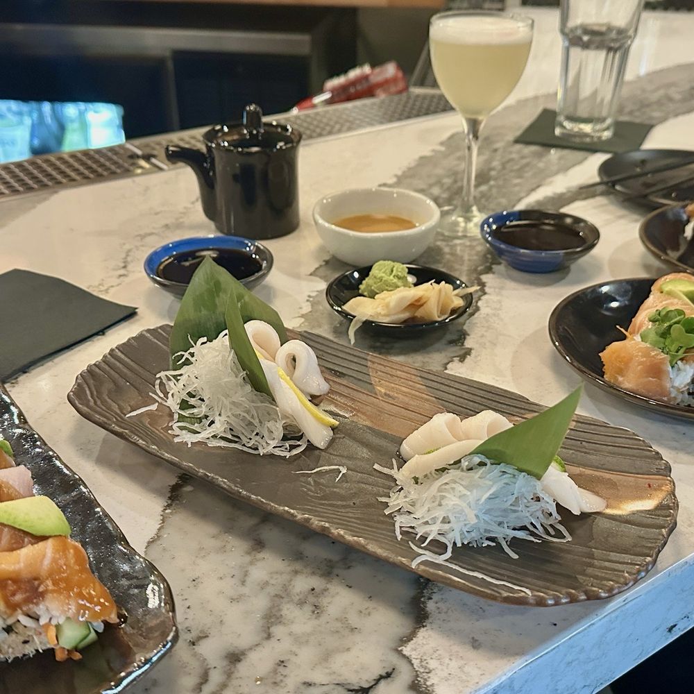 Rainbow roll, Walu Sashimi, salmon smash roll and Maui lover roll with Grapes of Wrath cocktail