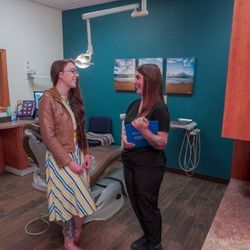 Rio Rancho Smiles - Rio Rancho dentist Dr. Sharareh Shokoohi explaining dental veneers procedure to cosmetic dentistry patient at Rio Rancho Smiles