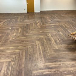 Floors & More - Vinyl plank in herringbone.