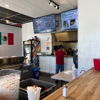 El Burro Veloz - a man standing at a counter - Mexican Near Me - Antioch, California El Burro Veloz - a man standing at a counter - Mexican Near Me - Antioch, California