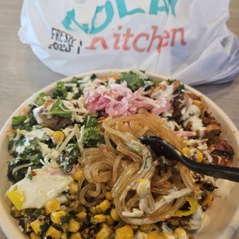 Bolay - Build-your-own-bowl: Sweet potato noodles. Kale salad. Lemon chicken. Corn, pickled onion, cheese and garlic sauce. - Gluten-Free Near Me - Fort Lauderdale, Florida