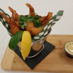 Hops Restaurant & Lounge - Popcorn Shrimp Breaded shrimp | popcorn | curried cilantro yogurt | cilantro | sesame seeds