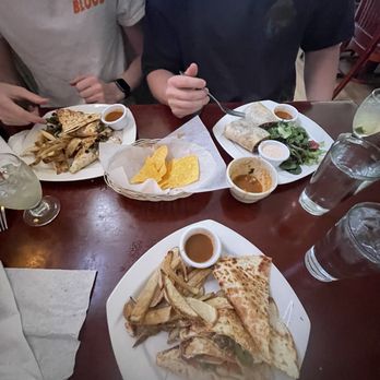 El Pope - The dishes, from 6, in a clockwise pattern, chicken quesadilla, steak quesadilla, and burrito. Just amazing, the burrito came with a salad. - Latin American Near Me - Richmond, Virginia