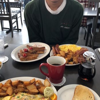 Maggie's Diner - a man sitting at a table with a plate of food - Breakfast & Brunch Near Me - Mississauga, Ontario Maggie's Diner - a man sitting at a table with a plate of food - Breakfast & Brunch Near Me - Mississauga, Ontario