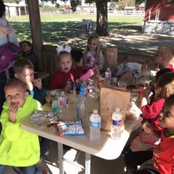 Abc's & 123's Infant and Child Care - Kids eating lunch at a picnic