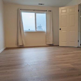 CM2J Construction - Converted garage with immaculate installation of new floors.  Vinyl that is so well done it looks like hardwood. - General Contractors Near Me