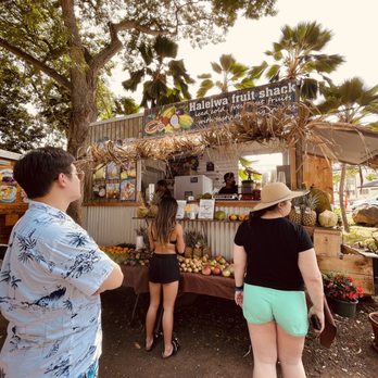 Haleiwa Fruit Shack - two people standing in front of a fruit stand - Juice Bars & Smoothies Near Me - Haleiwa, Hawaii Haleiwa Fruit Shack - two people standing in front of a fruit stand - Juice Bars & Smoothies Near Me - Haleiwa, Hawaii