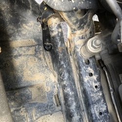 David Corry Chrysler Dodge Jeep Ram - Parts laying under engine.