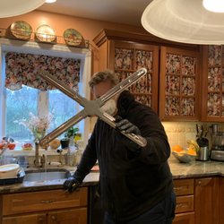 All Major Appliance Repair Service - A clogged sprayer in my dishwasher...  my service guy wearing a mask and gloves during COVID-19