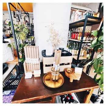 Flask & Field - a wooden table with books and vases on it - Beer, Wine & Spirits Near Me - Los Angeles, California Flask & Field - a wooden table with books and vases on it - Beer, Wine & Spirits Near Me - Los Angeles, California