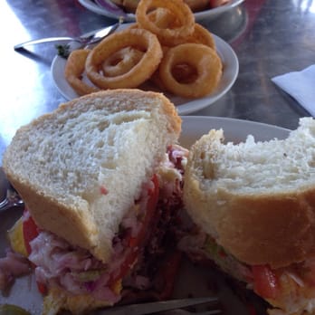 Metro Diner - Pittsburg sand which. That has pastrami , fried egg, French fries, coke slaw and cheese on sour dough Belgian waffles - Breakfast & Brunch Near Me - Jacksonville Beach, Florida