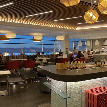 American Airlines Flagship First Lounge - Interior with wine and champagne bar - Airport Lounges Near Me - Jamaica, New York American Airlines Flagship First Lounge - Interior with wine and champagne bar - Airport Lounges Near Me - Jamaica, New York