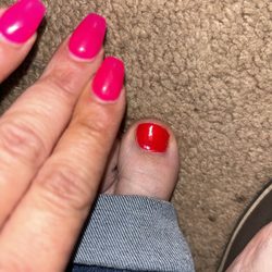 Laurel Nail Spa - Comparison of my nails and my toenails you can see the huge difference in color.