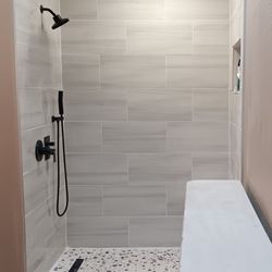 Oregon Interior Wall Specialists - Curb less roll in tile shower with rainfall showerhead, wand, regular shower head and a Bluetooth fan.