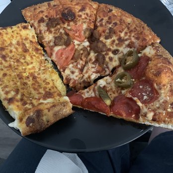 Hungry Howie's Pizza - Garlic cheese bread. Pepperoni and jalapeños,sausage and tomato pizza with Asiago crust. - Pizza Near Me - Las Vegas, Nevada Hungry Howie's Pizza - Garlic cheese bread. Pepperoni and jalapeños,sausage and tomato pizza with Asiago crust. - Pizza Near Me - Las Vegas, Nevada