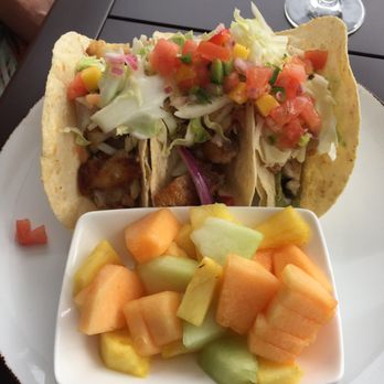 Primrose - Fish tacos (grouper) with a side of fruit. - Sushi Bars Near Me - Destin, Florida Primrose - Fish tacos (grouper) with a side of fruit. - Sushi Bars Near Me - Destin, Florida