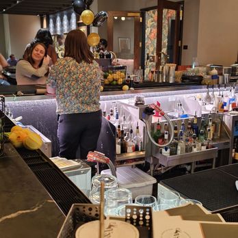 Baker & Able - They have some festive tropical flowery shirts here. - Cocktail Bars Near Me - Huntsville, Alabama